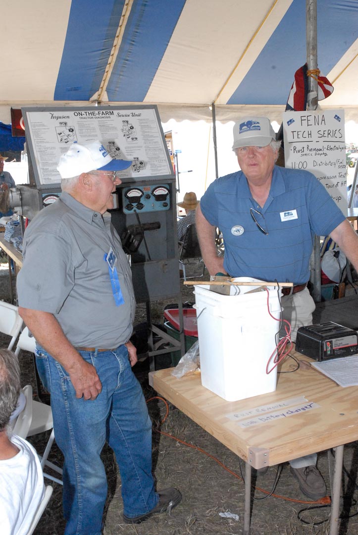 Joe Burk of Mount Vernon, Illinois (left), and Paul Nelson of Chino Valley, Arizona, discussing the demonstration display of electrolytic rust removal. This was a very popular display at the Expo because it was constantly in operation and the attendees could see how easy it is to use and how fast it transforms rust back into iron.