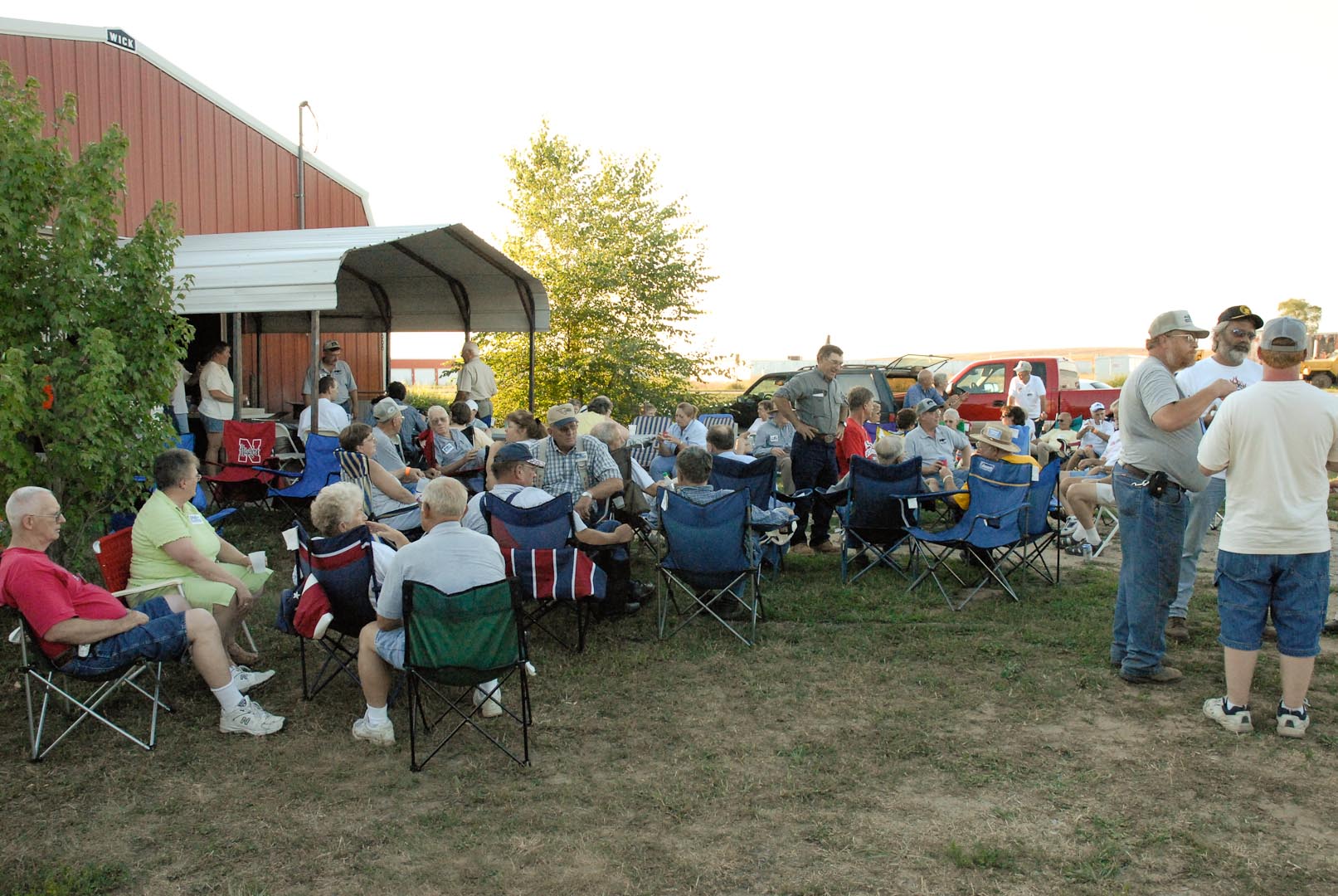 The crowd at Gene Kruse Red Barn in Lincoln, Nebraska, for a Saturday evening chicken dinner. About 100 FENA members and their families attended and enjoyed Gene and Joy's gracious hospitality. There was no formal program  - just good folk sitting around chatting about old tractors and just about anything else that came to mind.
