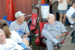 Lee Folkerts of Allison, Iowa (left), chatting with Jim Storment of Mount Vernon, Illinois, at GeneΓÇÖs barn on Saturday evening, almost certainly about old Ferguson tractors.