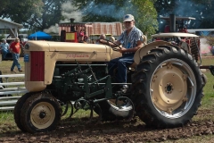 Al Hoyt of Center Hill, FL on his F-40 with 2-Row cultivator.