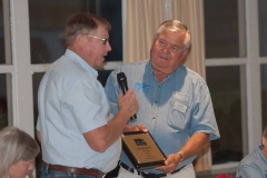 Melvin Sprague gives Ken Keeven a plaque honoring his year as president.