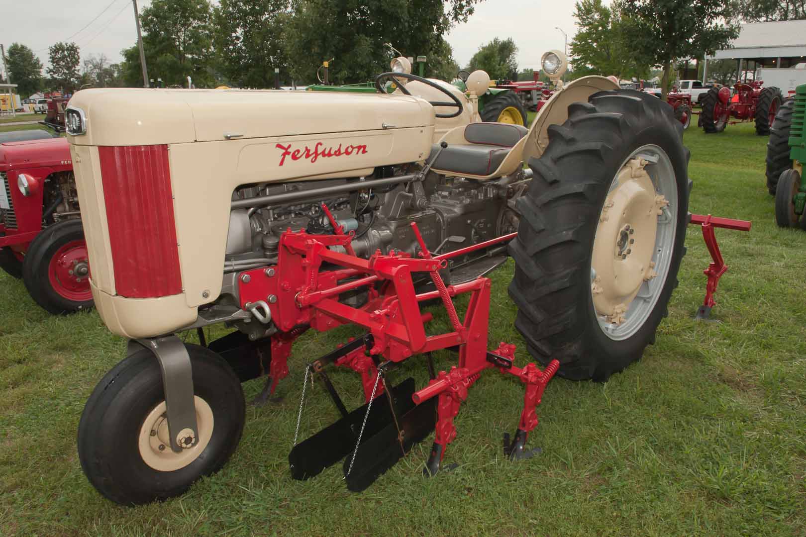1957 F-40 SN TGM405675 owned by Mickey Keener of Pattonville, TX.  Note the single front wheel.  Implement is a 1957 MHF Mid-Mount Cultivator and rear cultivator.