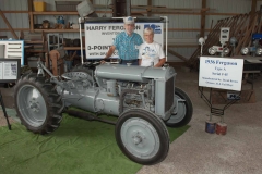 1936 Ferguson-Brown Model A SN 45 owned by Al Hoyt of Center Hill, FL.  Implement is a ten inch two bottom plow.  Al and Gail are pictured.